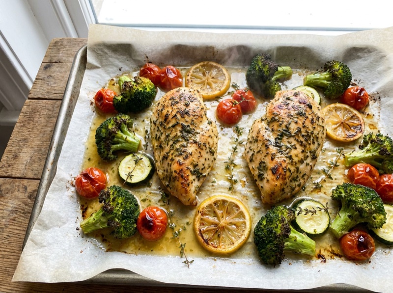 Sheet Pan Lemon Herb Chicken with broccoli, cherry tomatoes and courgette